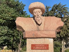 08A Statue of famous manaschi of the Manas story like talented singer Tynybek in front of Philarmonic Hall Bishkek Kyrgyzstan