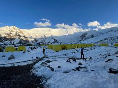 03A The tents of Ak-Sai Travel Lenin Peak Camp 1 4400m after a snowfall with Lenin Peak beyond in the late afternoon