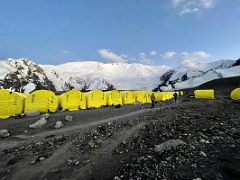 06C Lenin Peak is white after sunset with the tents of Ak-Sai Travel Lenin Peak Camp 1 4400m