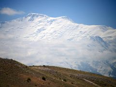 15C Lenin Peak towers across the plan after leaving the Pamir Highway on the way to Lenin Peak Base Camp