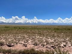 16A Mountain range includes Lenin Peak towering above the plain after leaving the Pamir Highway on the way to Lenin Peak Base Camp