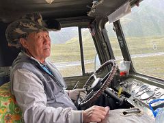 03B The old cowboy-like driver of the old military-style truck carrying us from Base Camp 3600m to the beginning of the trek at 3800m toward Ak-Sai Travel Lenin Peak Camp 1 4400m