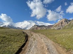 03C The rough road with Lenin Peak beyond from the old truck carrying us from Base Camp 3600m to the beginning of the trek at 3800m toward Ak-Sai Travel Lenin Peak Camp 1 4400m