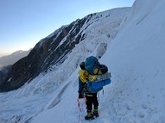 07B Traversing below a very steep snow slope in the crevasse area on the way to Ak-Sai Travel Lenin Peak Camp 2 5400m