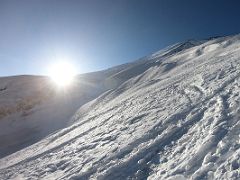 09A The sun hits the slopes of Lenin Peak as we climb toward Ak-Sai Travel Lenin Peak Camp 2 5400m