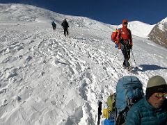 11A Climbers descending past us as we take a break on the slopes of Lenin Peak on the way to Ak-Sai Travel Lenin Peak Camp 2 5400m