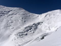 03D The Lenin Peak climbing route descends from Razdelnaya Peak Camp 3 6100m and then ascends to camp 4 on the far left at 6430m