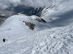 05A Looking down at the steep face of Razdelnaya Peak and the route to camp 2 on the way to Ak-Sai Travel Lenin Peak Camp 3 6100m