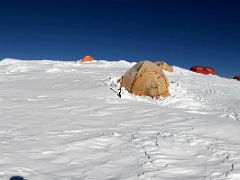 01A Starting the 80m vertical descent from the tents of Ak-Sai Travel Lenin Peak Camp 3 6100m to the col below on the way to camp 4 6430m