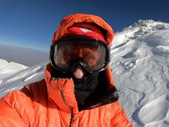 06A Jerome Ryan in the morning sun at about 6740m after climbing the steep snow slope on the way to the Lenin Peak summit