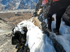 06C Trekking along a narrow snow-filled ledge on the way to Lobuche East Base Camp