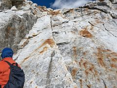 08A Preparing to climb the steepest section of the rocky boulder slabs with hand ropes on the way to Lobuche East High Camp 5600m