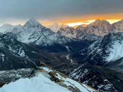 02A The sun burned bright orange as it broke thru the clouds over Ama Dablam, Malanphulan, Kangtega, Thamserku from just beyond Lobuche East High Camp 5600m