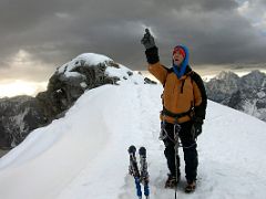 04B I point to two mountaineers near the summit of Lobuche East Peak before I tackle the last large rock to get to the snow slpopes