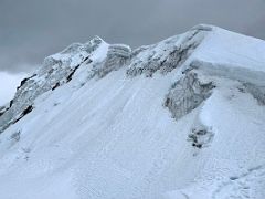 14A Looking across and up at the true Lobuche East summit from the fore summit