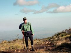 01B Jerome Ryan Trekking In The Early Morning Sun From Old Moses Camp Toward Shipton Camp On The Mount Kenya Trek October 2000