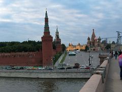 08B Looking up at the Red Square from Bolshoy Moskvoretsky bridge with Kremlin Beklemishevskaya Tower, Gum shopping mall, and St Basil Cathedral Moscow Russia