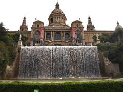 03C Water falls from the top of the multi-level fountain leading to the Museu Nacional d Art de Catalunya Palau Nacional building Barcelona Spain