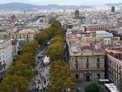 16A Tree-lined La Rambla and a view of Barcelona to the surrounding hills from the Columbus monument viewing platform Barcelona Spain