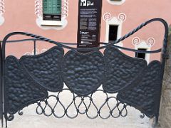 01E Gaudi House-Museum has a metal gate with interlocking shapes Park Guell Barcelona Spain