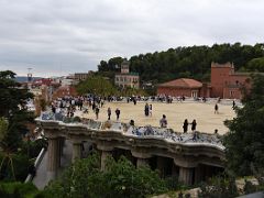 04A The main square has a long serpentine bench and rests on Doric columns of the market place below Park Guell Barcelona Spain