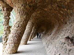 07A Portico of the Washerwoman is part of the viaduct composed of slanted trunk-shaped columns Park Guell Barcelona Spain