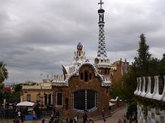 09A Porters Residence has a tower topped by a cross and a beautiful roof covered with trencadis, a mosaic made of tile shards Park Guell Barcelona Spain