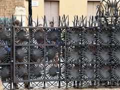 10 The Iron Entrance Gate formed in the shape of palm leaves Park Guell Barcelona Spain