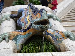 15A The dragon, or salamander, covered with decorative tile-shard mosaic is the most popular image of the park on the entrance steps Park Guell Barcelona Spain