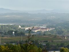 01A Cavas Codorniu is visible below the highway as we drive into Sant Sadurni Penedes wine tour Near Barcelona Spain
