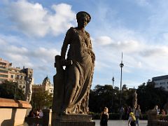 04B Navigation by Eusebi Arnau 1928 A standing woman is holding a tiller used to steer a traditional Catalan boat in Placa Catalunya Barcelona Spain