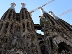 01B The Nativity facade has four spires and the Tree of Life, a bright green cypress tree Sagrada Familia Barcelona Spain