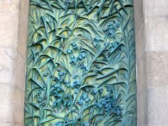 02F Green door with aquatic vegetation by Japanese sculptor Etsuro Sotoo Hope portico Nativity facade Sagrada Familia Barcelona Spain