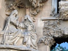 03D Visitation of the Virgin Mary, who was pregnant with Jesus, to St Elizabeth, who was pregnant with John the Baptist Faith portico Nativity facade Sagrada Familia Barcelona Spain