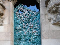 03F Rose door features roses, birds, and butterflies by Japanese sculptor Etsuro Sotoo Faith portico Nativity facade Sagrada Familia Barcelona Spain