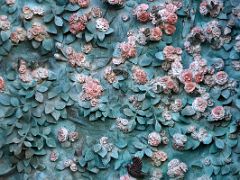 03G Rose door features roses, birds, and butterflies by Japanese sculptor Etsuro Sotoo Faith portico Nativity facade Sagrada Familia Barcelona Spain