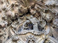 04B Annunciation - archangel Gabriel tells Mary that she is the chosen one who will bring the son of God into this world Charity portico Nativity facade Sagrada Familia Barcelona Spain