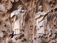 04E Chorus of angels playing the violin and lute Charity portico Nativity facade Sagrada Familia Barcelona Spain