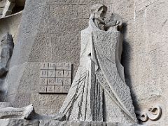 07A Kiss of Judas - Jesus died at 33 - All rows and columns of the magic square add up to 33 The serpent is the symbol of the Devil Passion facade Sagrada Familia Barcelona Spain