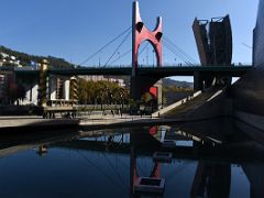 07D Arcos rojos - Daniel Buren 2007 and La Salve Bridge reflected in water Guggenheim Bilbao Spain