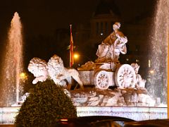 05B Cibeles Fountain depicts Greek goddess Cybele atop a chariot drawn by two lions At Night Madrid Spain