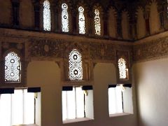 04A Light enters the synagogue thru windows with reliefs on the wall El Transito Synagogue Toledo Spain