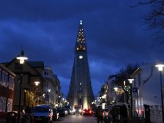 01C Looking up Skolavordustigur to Hallgrimskirkja Church lit up in early evening Reykjavik Iceland