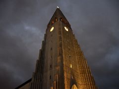 02B Front and side main facades of Hallgrimskirkja Church lit up in early evening Reykjavik Iceland