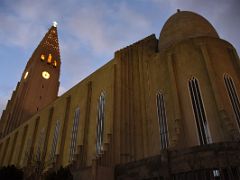 02C Hallgrimskirkja Church from the back with a view to the side facade and the tower lit up in early evening Reykjavik Iceland