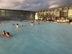 02D Looking back at the building where you hang up your white robe and enter the hot blue refreshing water Blue Lagoon geothermal spa Iceland