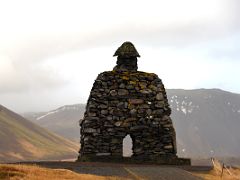 01C A huge stone structure of Bardur Snaefellsas from behind with mountains beyond in Arnarstapi Snaefellsnes Peninsula Iceland