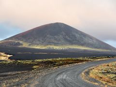 08B Driving on dirt road 558 past a black and green crater in Berserkjahraun lava field Snaefellsnes Peninsula Iceland