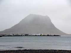 04B Looking across at the houses of Grundarfjordur with Kirkjufell mountain behind Snaefellsnes Peninsula Iceland