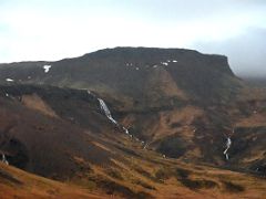 03B Waterfalls fall from the mountains next to Road 574 as we near road 54 on Snaefellsnes Peninsula Iceland